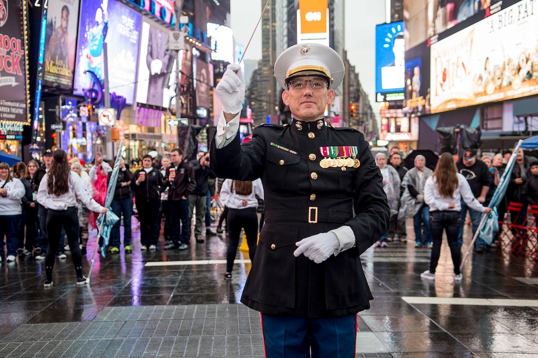 Marine Corps Chief Warrant Officer 4 Robert Sabo, the band director of Marine Corps Base Quantico, leads a rendition of the Marines' Hymn to celebrate the Marine Corps birthday in New York City, Nov. 9, 2015. Sailors and Marines from local units participated in the city's Veterans Day Parade to honor the service of the nation's veterans. U.S. Navy photo by Petty Officer 2nd Class Nancy C. diBenedetto