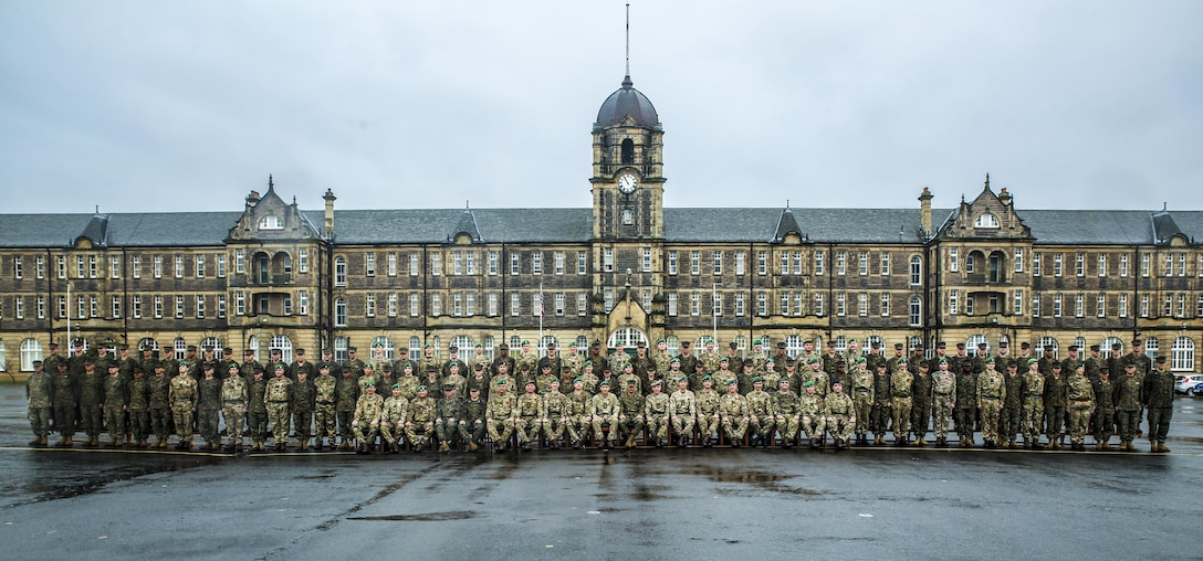 U.S. Marines with 2nd Intelligence Battalion and British soldiers pose for a photo as they conclude Exercise Phoenix Odyssey II in front of the Redford Barracks in Edinburgh, U.K., Nov. 7, 2015. This was the second consecutive year that both forces came together to conduct the exercise, which enhances joint intelligence operations and strengthens the relationship between the two forces. 