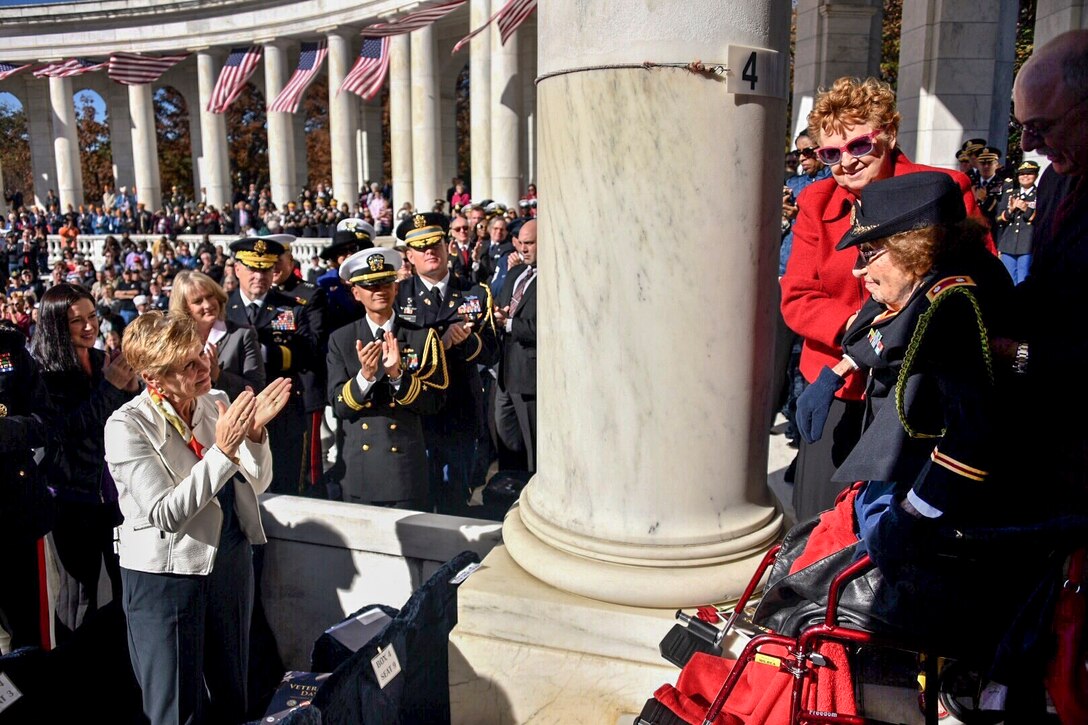 Retired Army Lt. Col. Luta C. McGrath, the oldest known female World War II veteran, receives a standing ovation after President Barack Obama mentioned her during a ceremony at the Tomb of the Unknown Soldier in Arlington National Cemetery in Arlington, Va., Nov. 11, 2015. U.S. Coast Guard photo by Petty Officer 2nd Class Patrick Kelley