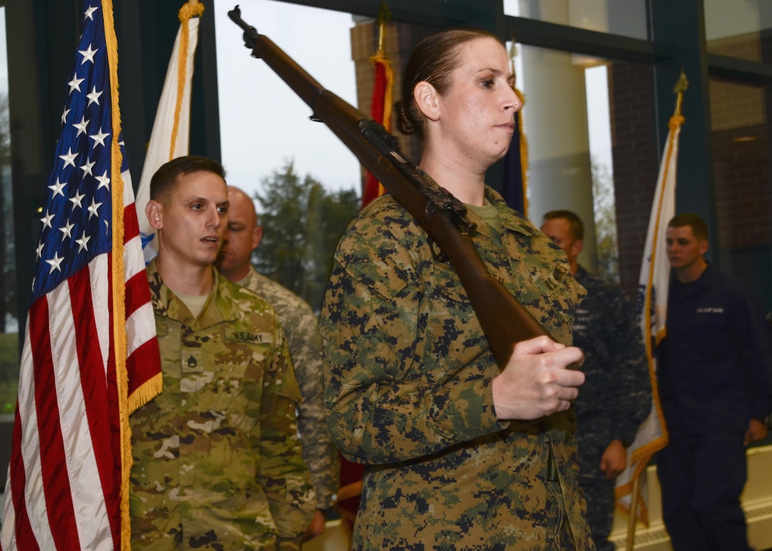 Marine Corps Sgt. Melissa L. Karnath leads the Joint Service Color Guard of the Defense Information School at Fort Meade, Md., in the school’s Hall of Heroes in a Nov. 9, 2015, practice session. Members of the color guard, which includes service members from the Army, Marine Corps, Navy, Air Force and Coast Guard, participate in  ceremonies to honor the flag and the nation.
