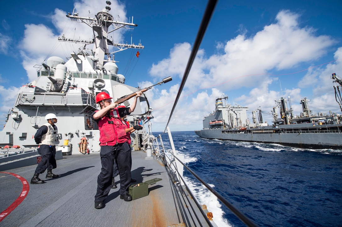 U.S. Navy Petty Officer 3rd Class Megan Smith, right, fires a shot line to the Military Sealift Command replenishment oiler USNS Tippecanoe from the guided missile-destroyer USS Fitzgerald during a replenishment in the East China Sea, Nov. 8, 2015. The Fitzgerald is on patrol in the 7th Fleet are of responsibility supporting security and stability in the Indo-Asia-Pacific region. Smith is a gunner's mate. U.S. Navy photo by Petty Officer 3rd Class Patrick Dionne