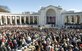 Audience members gathered for the National Veterans Day Observance at the Arlington National Cemetery amphitheater stand up as President Barack Obama enters the stage on Nov. 11, 2015. (U.S. Air Force photo/Sean Kimmons)