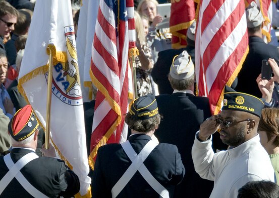 Color guards representing the military branches and various organizations walk past audience members during the National Veterans Day Observance at Arlington National Cemetery in Arlington, Va., on Nov. 11, 2015. (U.S. Air Force photo/Sean Kimmons)