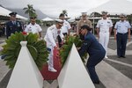 U.S. Navy Adm. Harry Harris, commander of U.S. Pacific Command (PACOM), helps place a military wreath with federal and military leaders of PACOM and the U.S. Coast Guard during the 2015 Governor’s Veterans Day Ceremony at the Hawaii State Veterans Cemetery Nov. 11, in Kaneohe, Hawaii. U.S. Army Maj. Gen. Arthur J. Logan, the adjutant general of the state of Hawaii, and Shan Tsutsui, lieutenant governor of Hawaii, provided welcoming remarks and a keynote speech during the ceremony. (U.S. Air Force photo by Staff Sgt. Christopher Hubenthal)
