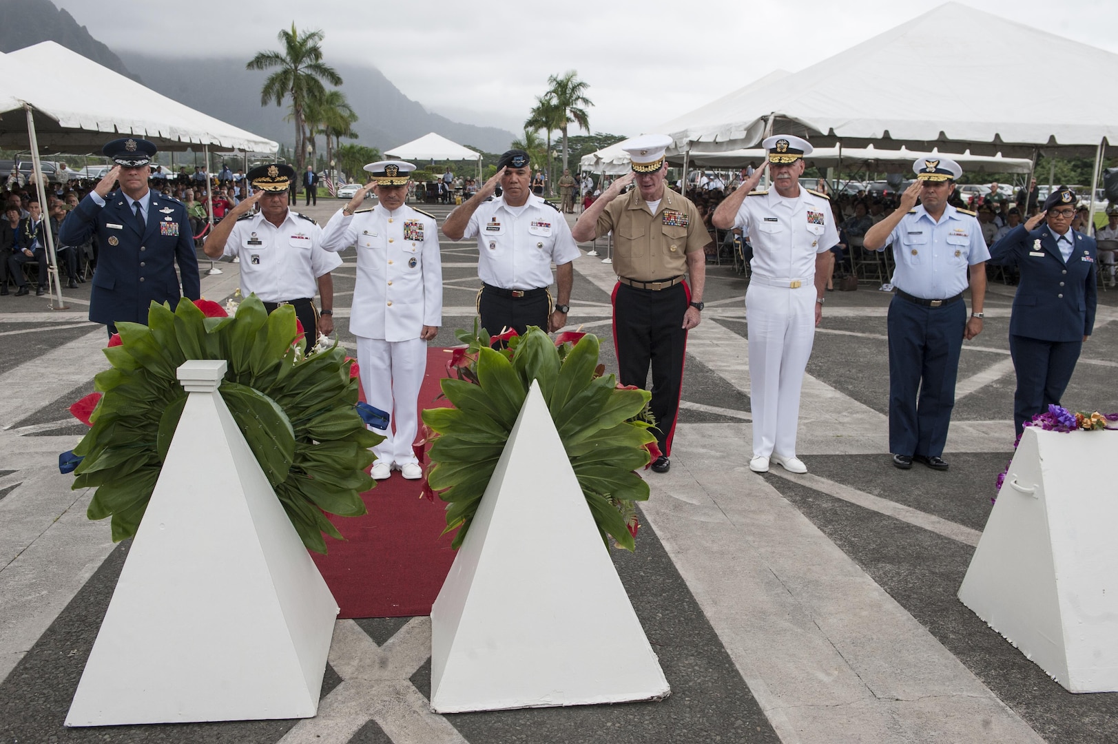 U.S. Navy Adm. Harry Harris, commander of U.S. Pacific Command (PACOM), salutes a military wreath alongside leaders of PACOM and the U.S. Coast Guard during the 2015 Governor’s Veterans Day Ceremony at the Hawaii State Veterans Cemetery Nov. 11, in Kaneohe, Hawaii. U.S. Army Maj. Gen. Arthur J. Logan, the adjutant general of the state of Hawaii, and Shan Tsutsui, lieutenant governor of Hawaii, provided welcoming remarks and a keynote speech during the ceremony. (U.S. Air Force photo by Staff Sgt. Christopher Hubenthal)