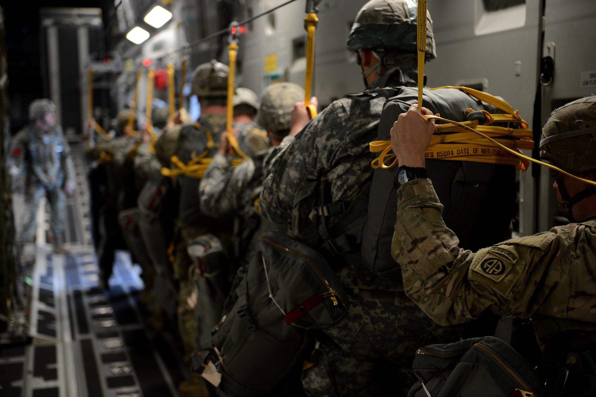 Soldiers from the 82nd Airborne Division prepare to jump out of a C-17 Globemaster III, Nov. 4, 2015, over Casa de Campos, Spain, during exercise Ultimate Reach. Ultimate Reach is an annual U.S. Transportation Command sponsored live-fly exercise designed to exercise the ability of 18th Air Force to plan and conduct strategic airdrop missions. (U.S. Air Force photo/Senior Airman Divine Cox)