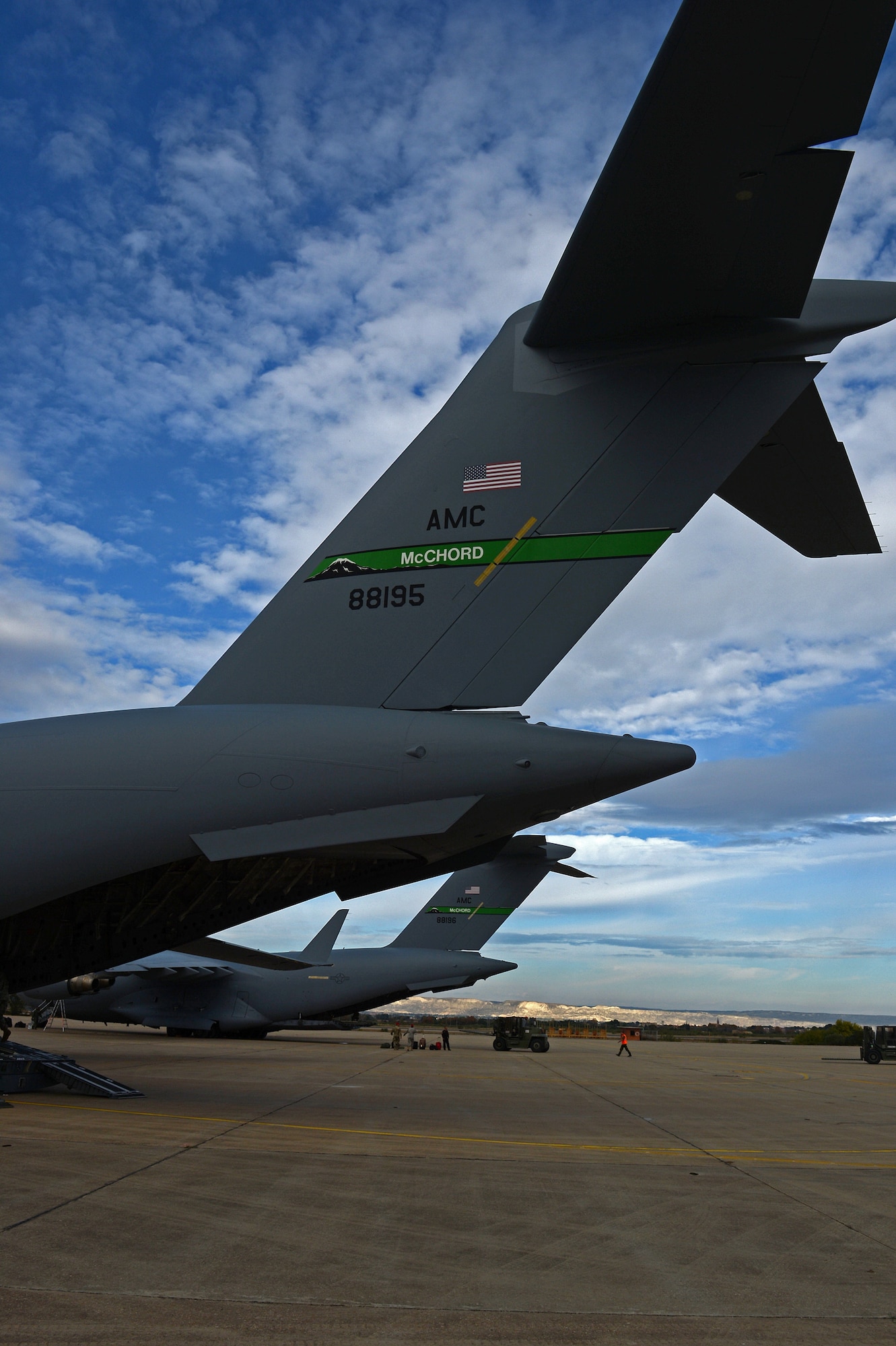 Two C-17 Globemaster III aircraft park on the flight line of Zargoza Air Base, Spain, Nov. 4, 2015, during exercise Ultimate Reach. Two C-17 crews from Joint Base Lewis-McChord, Wash., flew more than 150 Paratroopers of the 82nd Airborne Division’s 2nd Brigade Combat Team across the Atlantic to conduct a joint forcible entry exercise over Zaragoza, Spain. (U.S. Air Force photo/Senior Airman Divine Cox)