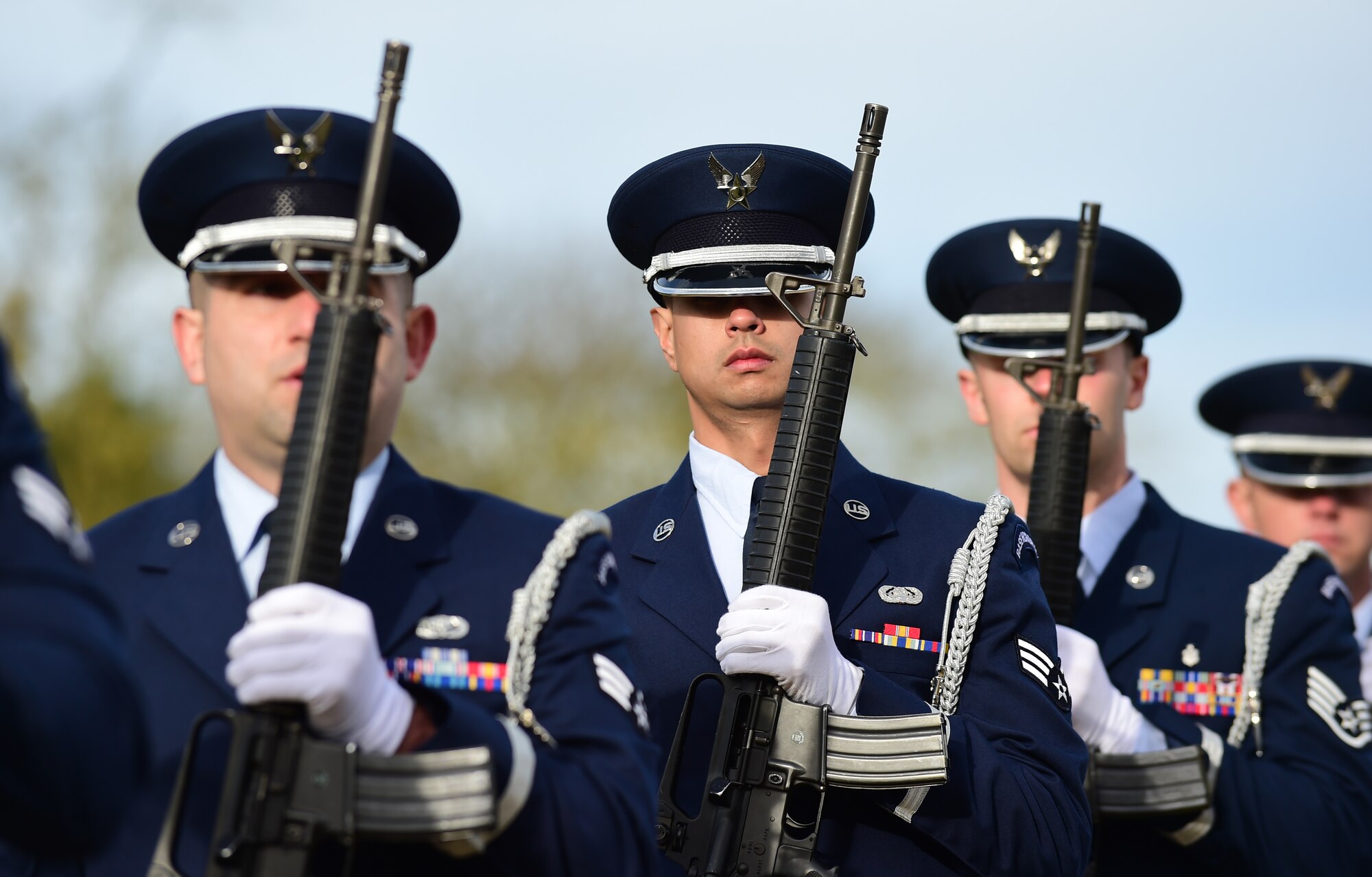 Members of the 423rd Air Base Group honor guard prepare for a volley during a Veterans Day ceremony at Cambridge American Cemetery, United Kingdom, Nov. 11, 2015. The honor guard paid tribute to Service members both past and present with a volley and the playing of Taps. (U.S. Air Force photo by Master Sgt. Chrissy Best/Released)