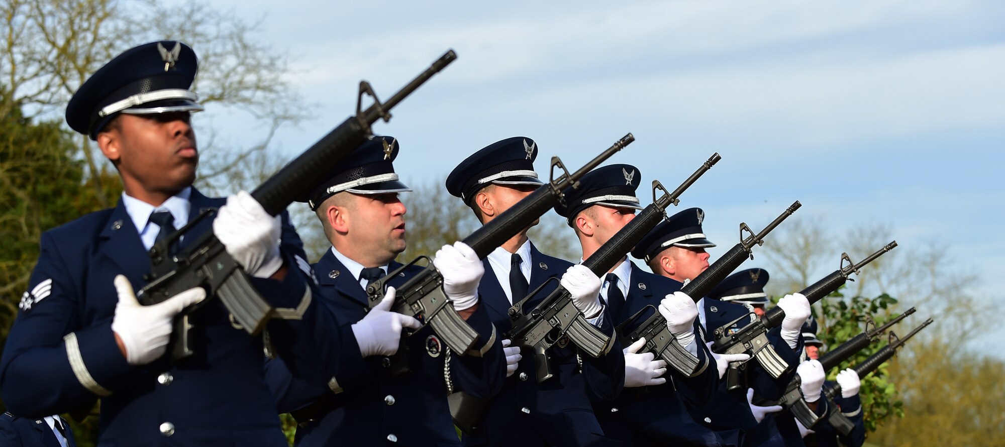 Members of the 423rd Air Base Group honor guard perform a volley during a Veterans Day ceremony at Cambridge American Cemetery, United Kingdom, Nov. 11, 2015. The Honor Guard paid tribute to Service members both past and present with a volley and the playing of Taps. (U.S. Air Force photo by Master Sgt. Chrissy Best/Released)