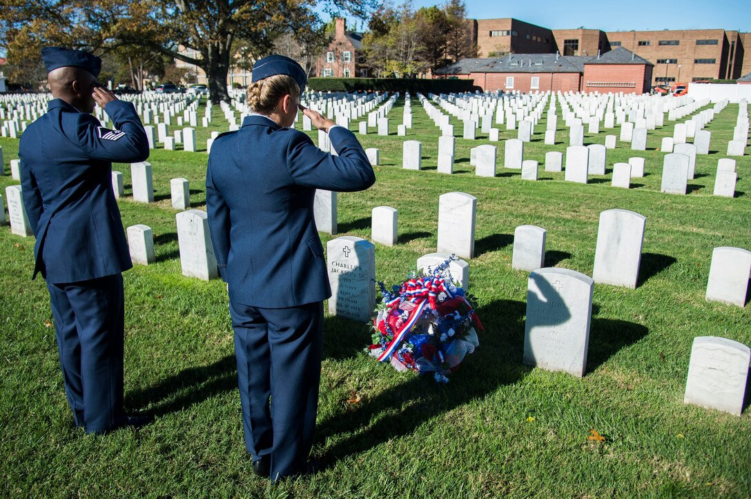 U.S. Air Force Col. Caroline M. Miller, commander of the 633rd Air Base Wing, and Master Sgt. Neco Johnson, Langley African American Heritage Council member, render salutes during a Veterans Day Wreath Laying in Hampton, Va., Nov. 11, 2015. Civil War medal of honor recipient, U.S. Army Pvt. Charles Veale received the wreath laid upon his grave. (U.S. Air Force photo by Senior Airman Kayla Newman/Released)
