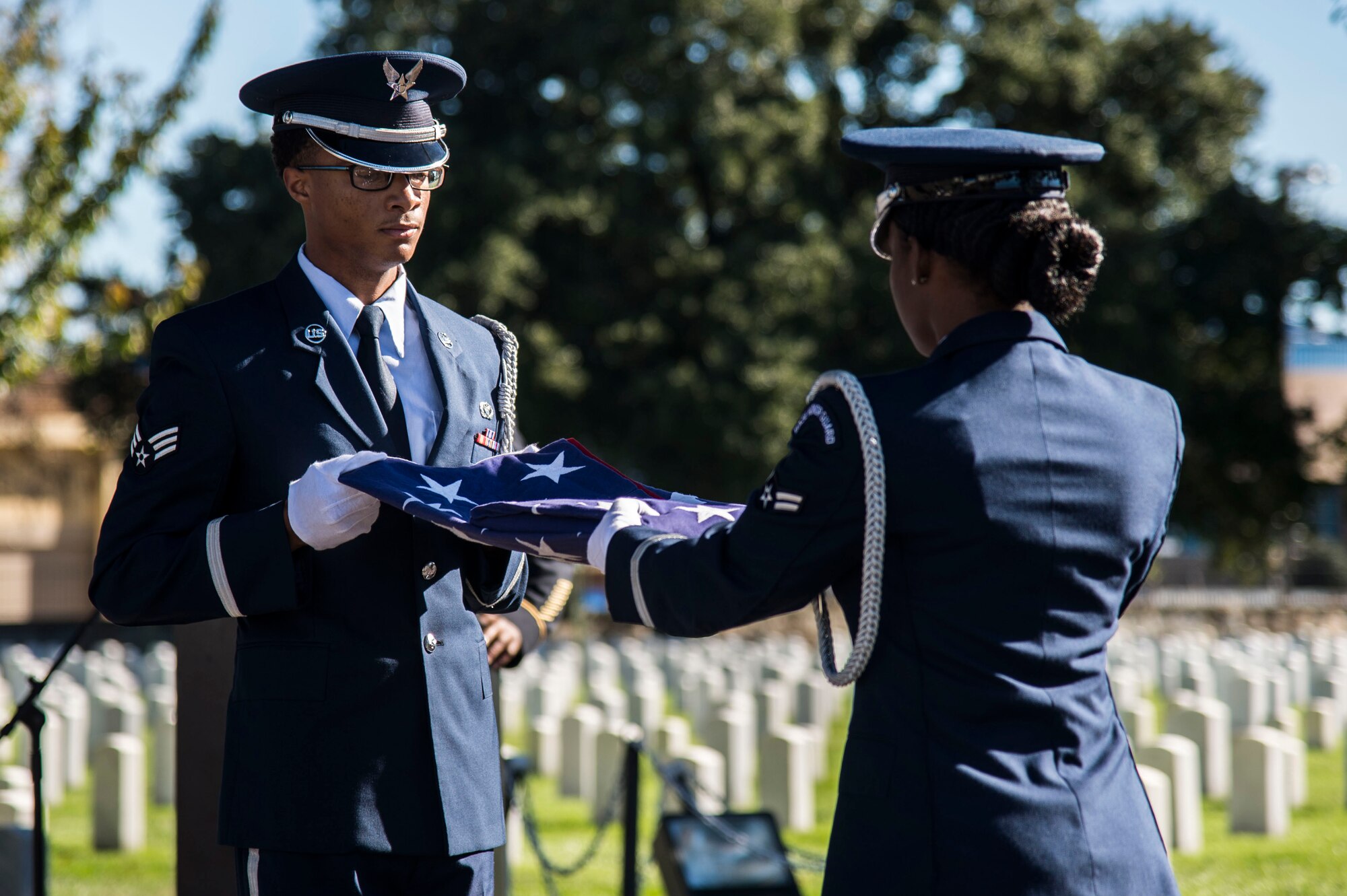 Members of the Langley Honor Guard perform a flag folding ceremony during a Veterans Day Wreath Laying in Hampton, Va., Nov. 11, 2015. The commander of the 633rd Air Base Wing, U.S. Air Force Col. Caroline M. Miller, laid a wreath on Civil War medal of honor recipient, U.S. Army Pvt. Charles Veale’s gravesite. (U.S. Air Force photo by Senior Airman Kayla Newman/Released)