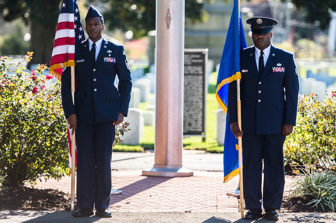 Members of the Langley African American Heritage Council hold the flags during a Veterans Day Wreath Laying in Hampton, Va., Nov. 11, 2015. The ceremony took place in the Hampton National Cemetery where Civil War medal of honor recipient, U.S. Army Pvt. Charles Veale was laid to rest.  