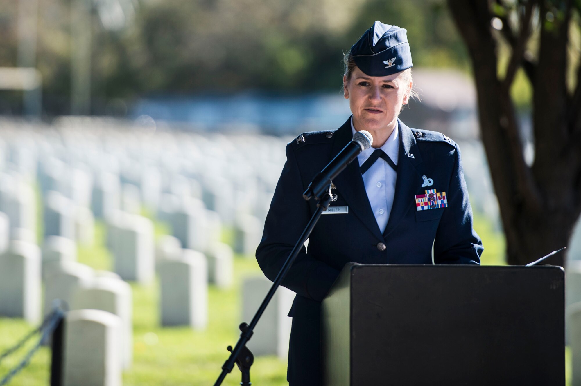 U.S. Air Force Col. Caroline M. Miller, commander of the 633rd Air Base Wing, gives a keynote speech during a Veterans Day Wreath Laying in Hampton, Va., Nov. 11, 2015. Miller spoke to the crowd on the history of Veterans Day and about U.S. Army Pvt. Charles Veale, whose grave received the laying of the wreath. (U.S. Air Force photo by Senior Airman Kayla Newman/Released)