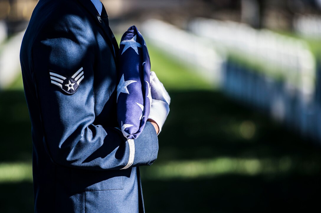 A Langley Honor Guardsman prepares to perform a flag folding ceremony during a Veterans Day Wreath Laying in Hampton, Va., Nov. 11, 2015. In addition to the flag folding, there was a keynote speaker, the laying of the wreath and the playing of taps. (U.S. Air Force photo by Senior Airman Kayla Newman/Released)