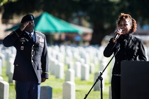 Sloane Maurice, singer, performs the national anthem during a Veterans Day Wreath Laying in Hampton, Va., Nov. 11, 2015. The ceremony was held in honor of medal of honor recipient and Civil War veteran, U.S. Army Pvt. Charles Veale. (U.S. Air Force photo by Senior Airman Kayla Newman/Released)