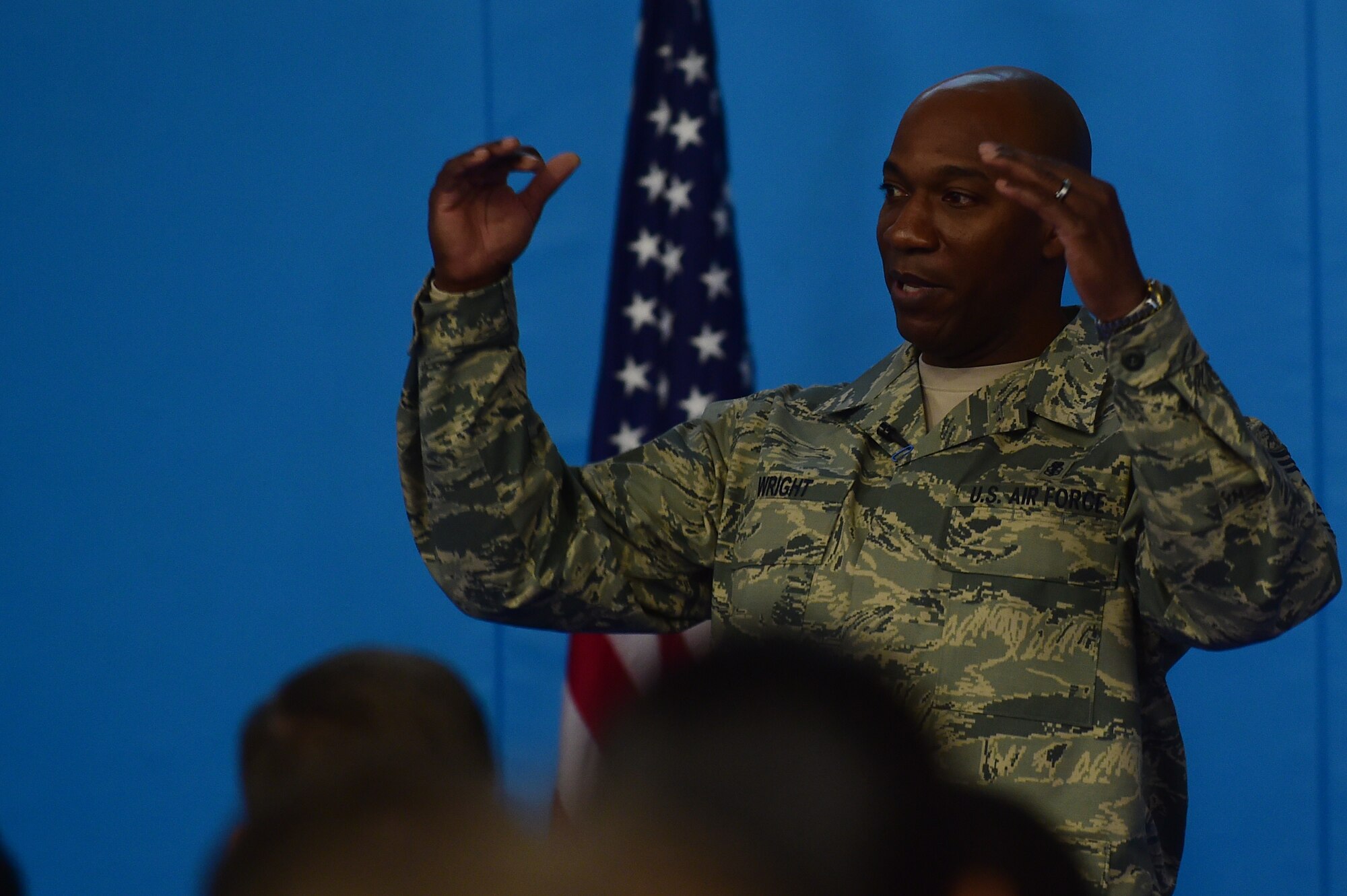 Chief Master Sgt. Kaleth Wright, the 3rd Air Force and 17th Expeditionary Air Force command chief, speaks to Airmen during an all-call at RAF Croughton, United Kingdom, Nov. 10, 2015. During the all-call, Wright spoke about character, attitude, discipline, excellence and teamwork (CADET), which he calls the “Five keys to Success”.  (U.S. Air Force photo by Master Sgt. Chrissy Best/Released)