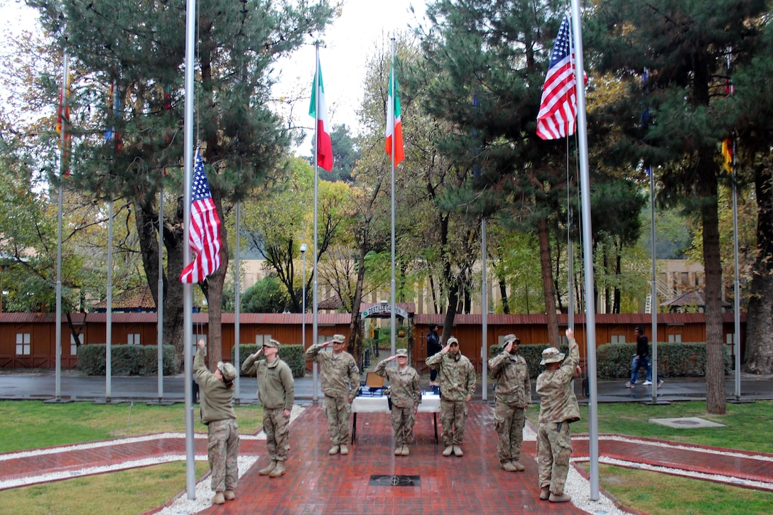 U.S. sailors raise the U.S. flag during a Veterans Day ceremony on Resolute Support Headquarters, Kabul, Afghanistan, Nov. 11, 2015. U.S. Navy photo by Lt. Charity Edgar