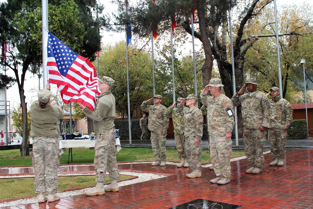 U.S. sailors raise the U.S. flag during a Veterans Day ceremony on Resolute Support Headquarters, Kabul, Afghanistan, Nov. 11, 2015. U.S. Navy photo by Lt. Charity Edgar