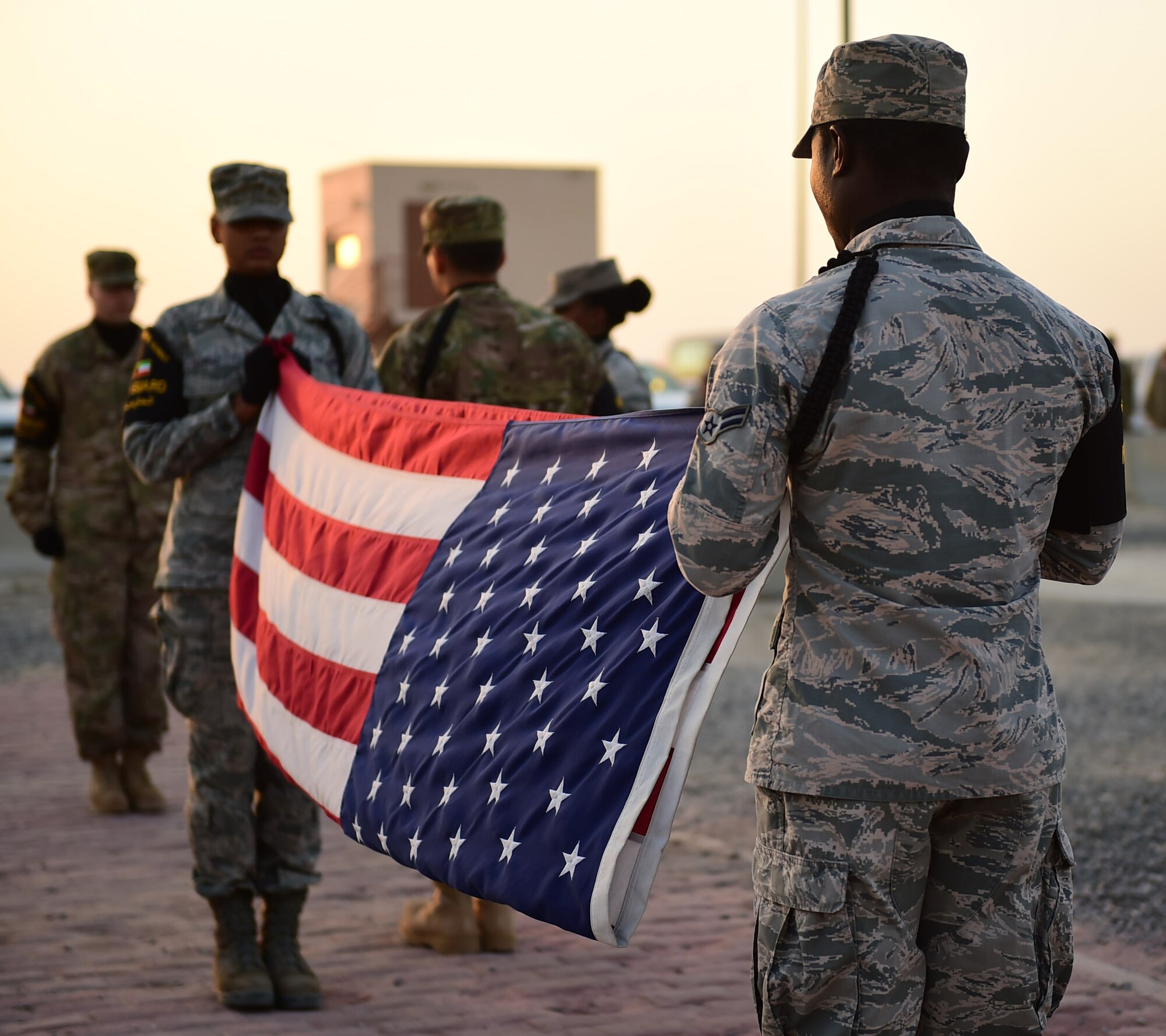 Airmen from the 386th Expeditionary Medical Group participate in the first-ever Raymond Weeks’ Veteran’s Day Memorial Challenge at an undisclosed location in Southwest Asia, Nov. 11, 2015. The challenge was named after a World War II veteran who petitioned to have what was then known as Armistice Day, which honors those who lost their lives while serving in the Armed Forces, expanded to honor all Veterans. (U.S. Air Force photo by Staff Sgt. Jerilyn Quintanilla)  