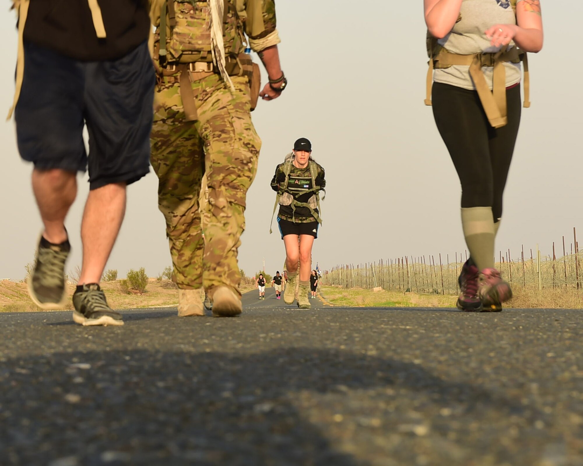 Airmen from the 386th Air Expeditionary Wing participate in an 11K ruck march at an undisclosed location in Southwest Asia, Nov. 11, 2015. Veteran’s Day serves as a day to remember and honor the service and sacrifices made by those in the Armed Forces, past and present, and their families. (U.S. Air Force photo by Staff Sgt. Jerilyn Quintanilla)