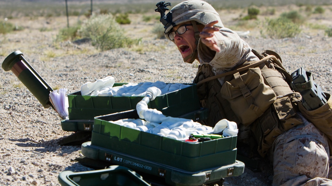 U.S. Marine Corps Lance Cpl. Evan L. Bohlke, a combat engineer with Alpha Company, 1st Battalion, 8th Marine Regiment, 2nd Marine Division (MARDIV), yells for everyone to fall back before setting off an anti-personnel obstacle breaching system during Integrated Training Exercise 1-16 aboard Marine Corps Air Ground Combat Center, Twentynine Palms, Calif., Oct. 30, 2015. Marines participate in a month-long field exercise demonstrating core mission essential tasks by conducting offensive, defensive and stability operations using combined arms, air integration, and battalion-level infantry tactics in order to strengthen operational readiness as they prepare for world-wide deployment. 