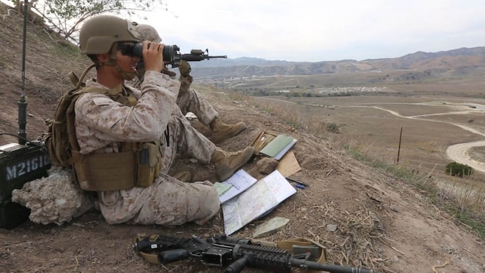 Marines with 1st Air Naval Gunfire Liaison Company observe impacts from an M777 A2 Howitzer during an ANGLICO Basic Course aboard Marine Corps Base Camp Pendleton, Calif., Oct. 27, 2015. The ANGLICO Basic Course, also known as ABC, is a six-week course divided into three sections implementing motor transportation, communications and call-for-fire techniques.