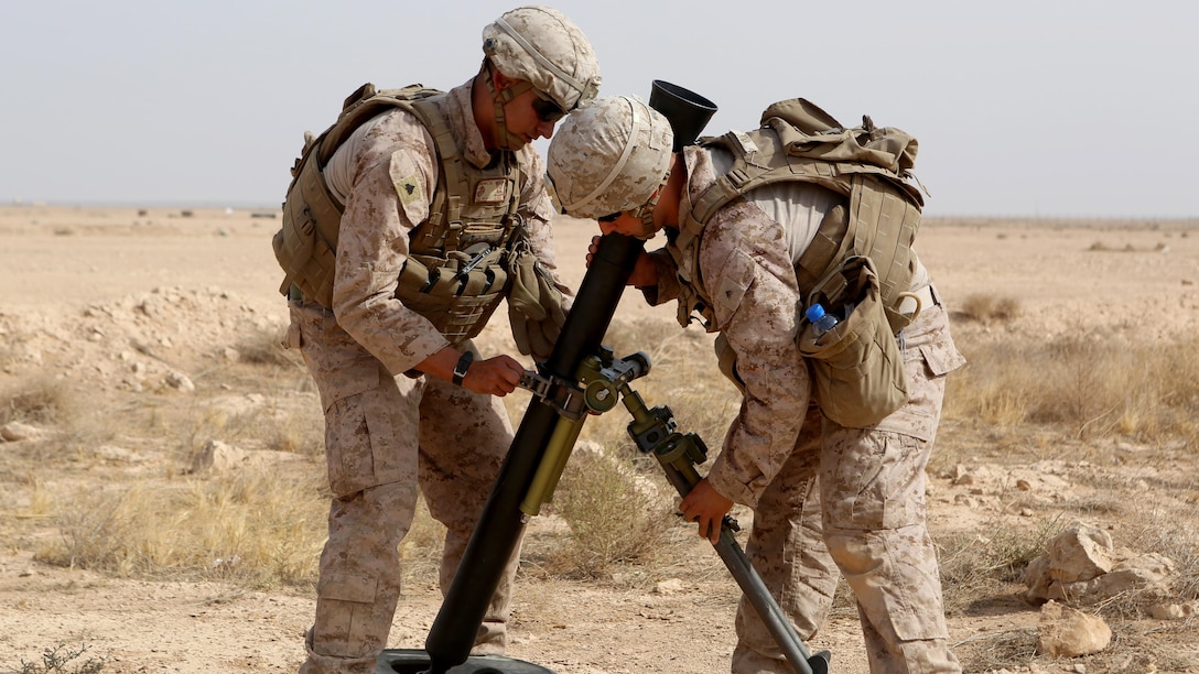 U.S. Marines with Weapons Company, 1st Battalion, 7th Marine Regiment, Special Purpose Marine Air-Ground Task Force--Crisis Response--Central Command, assemble a new M252A2 81mm mortar system during a live-fire training mission at Al Asad Air Base, Iraq, Oct. 24, 2015. The training allowed the Marines to build their proficiency with the new weapons system.  This unit is supporting the Combined Joint Task Force – Operation Inherent Resolve, which is a coalition of regional and international nations who have joined together to defeat the Islamic State of Iraq and the Levant and the threat they pose to Iraq, Syria, the region and the wider international community.