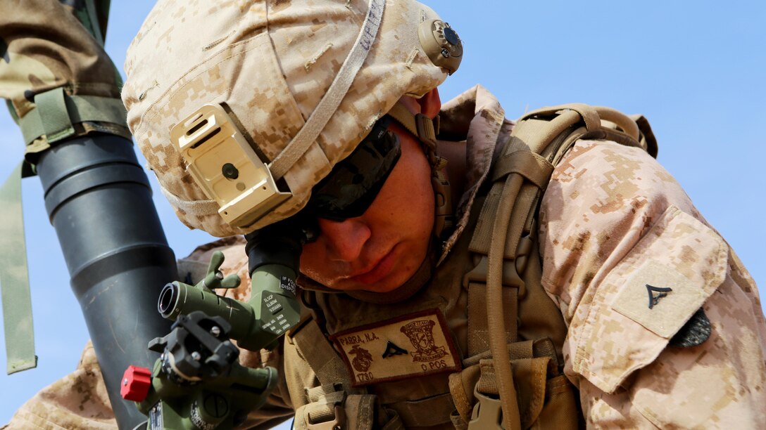 U.S. Marine Lance Cpl. Matthew Parra, a fires direction center coordinator with Weapons Company, 1st Battalion, 7th Marine Regiment, Special Purpose Marine Air-Ground Task Force--Crisis Response--Central Command, performs gun drills during a live-fire training mission at Al Asad Air Base, Iraq, Oct. 24, 2015.  The training allowed the Marines to become familiar with the M252A2 81mm mortar system as they honed their tactics, techniques and procedures in employment of the weapon.  This unit is supporting Combined Joint Task Force – Operation Inherent Resolve, a coalition of regional and international nations who have joined together to enable Iraqi forces to counter the Islamic State of Iraq and the Levant.