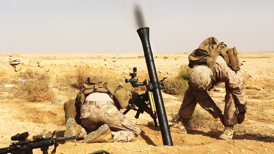 U.S. Marines with Weapons Company, 1st Battalion, 7th Marine Regiment, Special Purpose Marine Air-Ground Task Force--Crisis Response--Central Command, fire a M252A2 81 mm mortar system during a live-fire training mission at Al Asad Air Base, Iraq, Oct. 24, 2015. The training allowed the Marines to maintain proficiency while also expanding their knowledge on the new weapons system.  These Marines are supporting Combined Joint Task Force – Operation Inherent Resolve, which has 65 coalition partners who are committed to the goals of eliminating the threat posed by the Islamic State of Iraq and the Levant.