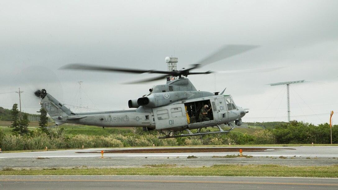 A UH-1Y helicopter lands in preparation for the boarding of Lt. Gen. Michael G. Dana Nov. 5 on Camp Courtney, Okinawa, Japan. Dana boarded the helicopter for an air tour of various strategic access points as well as Marine Corps bases on Okinawa from the air. After the air tour, Dana visited bases on Okinawa to assess and discuss manpower and financial needs. Dana is the deputy commandant for installations and logistics.