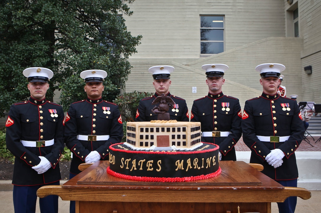 The Cake Cutting Team with Marine Barracks Washington, D.C. poses with the birthday cake prior to the start of the Pentagon Cake Cutting Ceremony hosted by the Commandant of the Marine Corps. The ceremony was held in honor of the 240th Birthday of the United States Marine Corps. (U.S. Marine Corps photo by Sgt. Melissa Marnell, Office of the 18th Sergeant Major of the Marine Corps/Released)