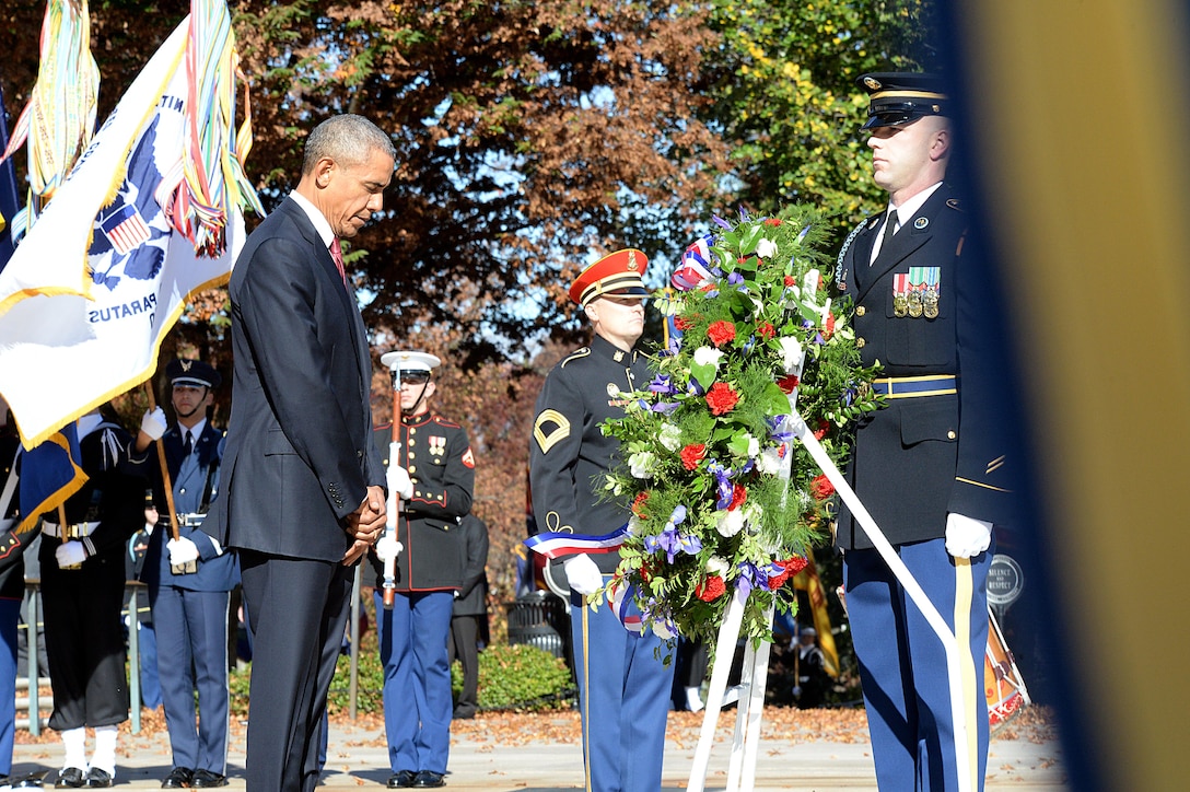 President Barack Obama bows his head at the 62nd annual national Veterans Day observance at Arlington National Cemetery, Arlington, Va., Nov. 11, 2015. (DoD photo by U.S. Army Sgt. First Class Clydell Kinchen)(Released)