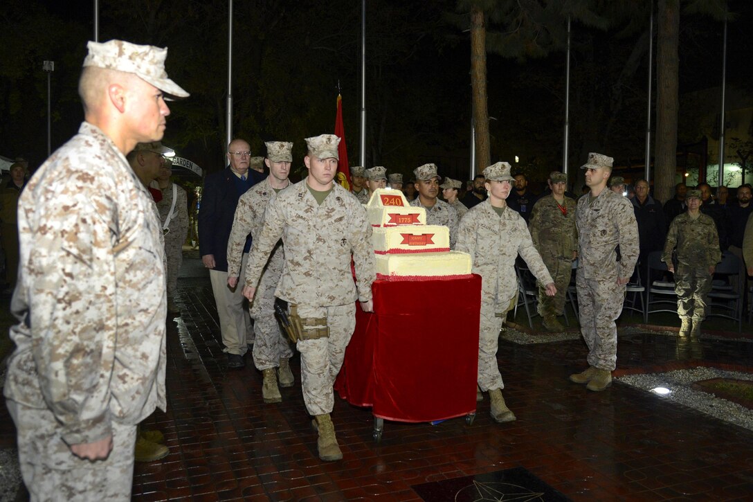 U.S. Marines wheel in a huge cake before celebrating the U.S. Marine Corps’ 240th birthday on Camp Resolute Support in Kabul, Afghanistan, Nov. 9, 2015. U.S. Air Force photo by Staff Sgt. Tony Coronado