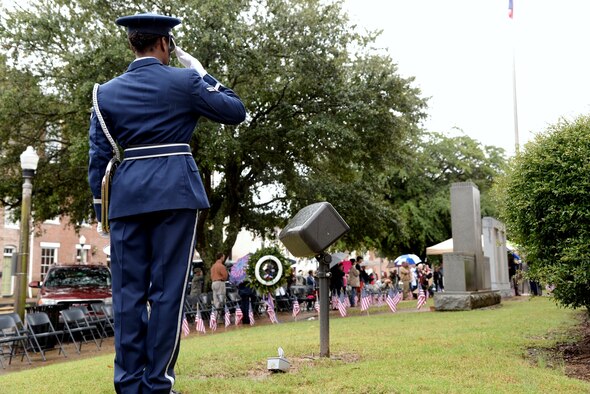 Airman 1st Class Brianna Brown, 14th Flying Training Wing Honor guardsman, salutes the flag during the presentation of Colors at the 2015 Veterans Day Ceremony Nov. 7 in Columbus, Mississippi. During the ceremony, Alice Stallworth Lancaster, Regent of the Bernard Romans Chapter Daughters of the American Revolution, read 22 names of those who did not return and who are listed on the right plaque of the monument. Afterward Col. John Nichols, 14th Flying Training Wing Commander, spoke on what Veterans Day meant to him before he laid a wreath on the memorial and offered a salute to close the day’s event with Harry Sanders, Lowndes County Board of Supervisors President, and Vice Columbus Mayor Gene Taylor. For story and more photos, see pages 8 and 9. (U.S. Air Force photo/Airman 1st Class John Day)
