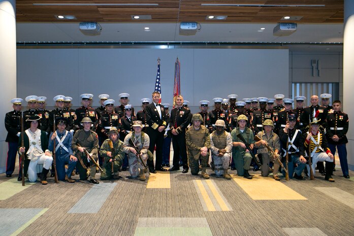 Brig. Gen. (select) Bradford Gering. commander of U.S. Marine Corps Forces Command, and Adm. Phil Davidson, commander of U.S. Fleet Forces Command, stand with U.S. Marine Corps Forces Command's 2015 Marine Corps Birthday Ball ceremony participants at the Virginia Beach Convention Center on Nov. 7, 2015. 