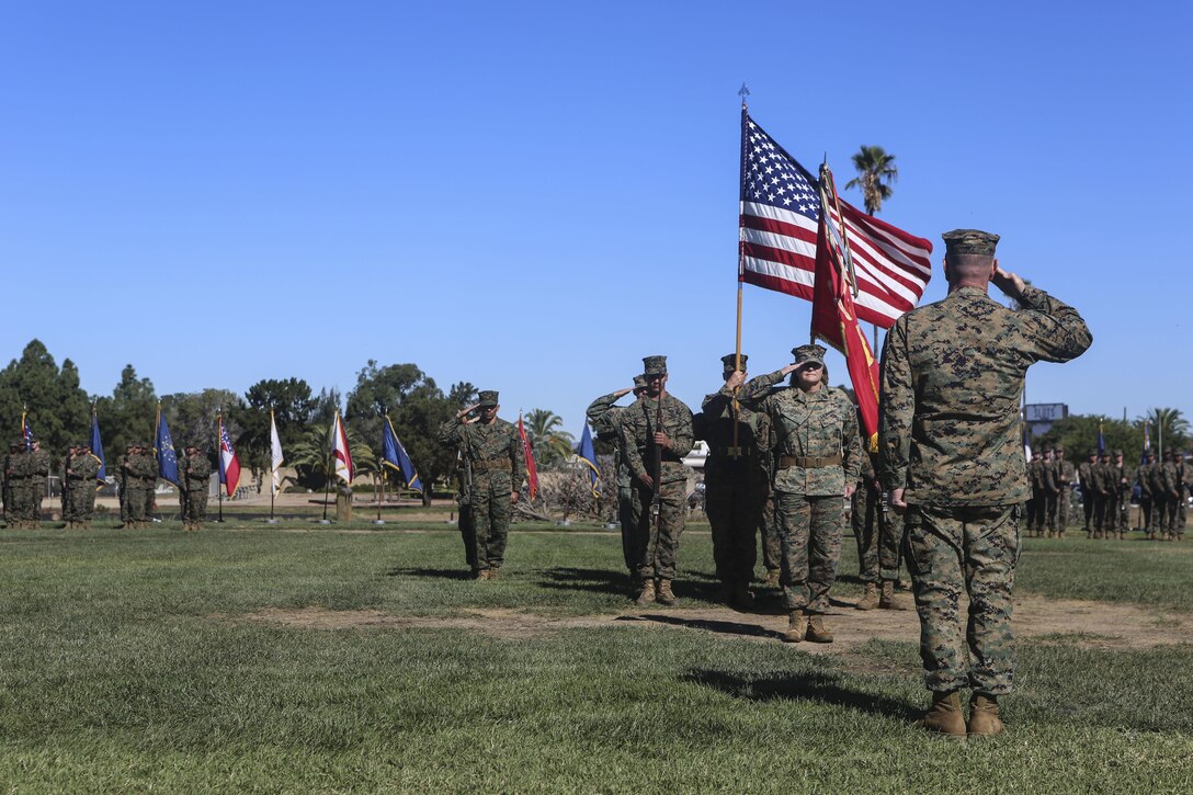 Master Gunnery Sgt. Diane Sharpe comes forward to begin her retirement ceremony aboard Marine Corps Air Station Miramar, Calif., Nov. 6. Sharpe, retiring after 30 years, was the first female to reach the rank of master gunnery sergeant in her military occupational specialty.