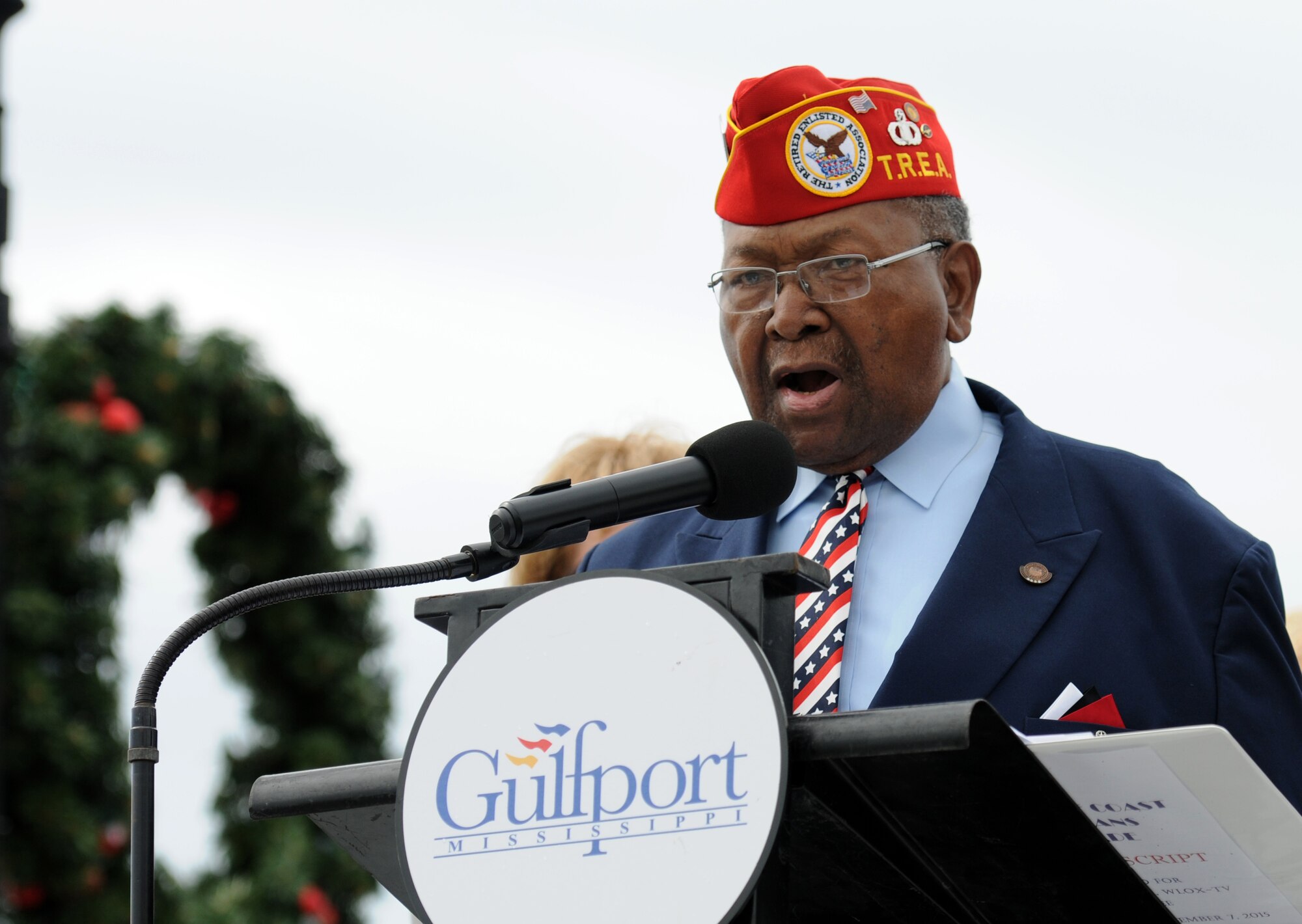Retired Chief Master Sgt. Chris Moore sings the National Anthem during the 15th Annual Gulf Coast Veterans Day Parade Nov. 7, 2015, in Gulfport, Miss. Keesler’s 81st Training Wing leadership, Honor Guard, 81st Training Group’s Drum and Bugle Corps, and Airmen participated in the event. (U.S. Air Force photo by Kemberly Groue)