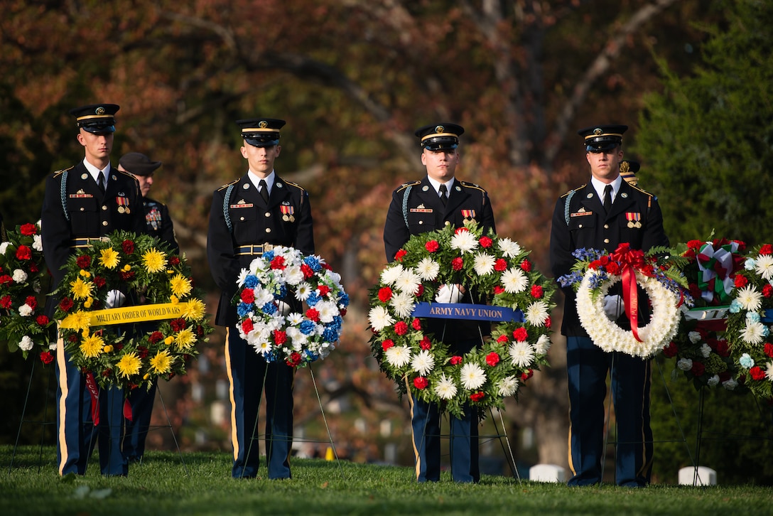 3rd U.S. Infantry Regiment soldiers stand next to wreaths that will be laid at General of the Armies John J. Pershing’s gravesite during a memorial ceremony for Pershing in Arlington National Cemetery in Arlington, Va., Nov. 11, 2015. The memorial service and wreath laying, organized by The Military Order of the World Wars, took place at Pershing’s graveside. U.S. Army photo by Rachel Larue