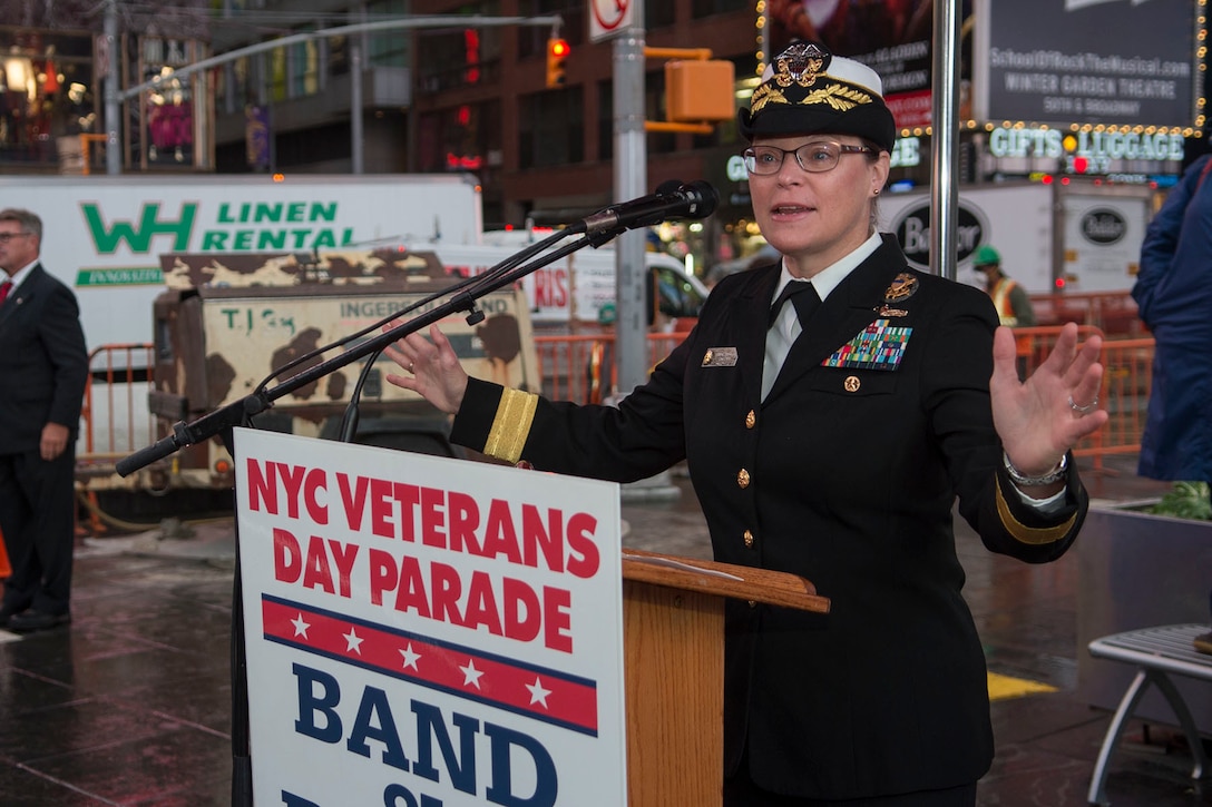 Navy Rear Adm. Cynthia M. Thebaud, commander of Expeditionary Strike Group 2, talks to a crowd about the unique relationship between USS New York and the ship's namesake city during a Veterans Day event in New York City, Nov. 10, 2015. The city honored veterans by hosting Veterans Week New York City 2015. U.S. Navy photo by Petty Officer 2nd Class Nancy C. diBenedetto