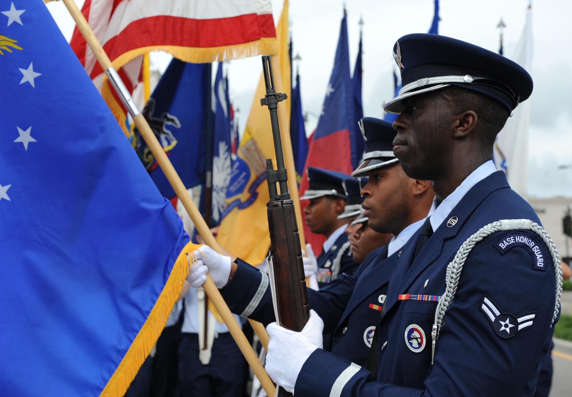 The Keesler Air Force Base Honor Guard presents the colors during the singing of the National Anthem during the 15th Annual Gulf Coast Veterans Day Parade Nov. 7, 2015, Gulfport, Miss. Keesler’s Wing leadership and the 81st Training Group’s Drum and Bugle Corps also participated in the event. (U.S. Air Force photo by Kemberly Groue)