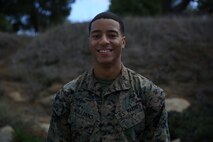 Corporal Brian Williams, the designated driver for the commanding general, 1st Marine Division, and wide receiver for the Headquarters Battalion Wolverines. While Williams is dedicated to his team, his duties as a Marine will always come first aboard Marine Corps Base Camp Pendleton, Calif. The Atlanta native ties his life of wearing shoulder pads to his desire to wear his Eagle, Globe and Anchor. (Official Marine Corps Photo by Cpl. Will Perkins)