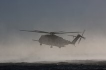 The pilots and crew of a CH-53E Super Stallion with Marine Heavy Helicopter Squadron-465, prepare to insert Marines with Company A, 1st Reconnaissance Battalion, 1st Marine Division, during helocast training off the coast of Marine Corps Base Camp Pendleton, Calif., Nov. 6, 2015. Helocasting allows Marines to swiftly and stealthily insert from a helicopter into any body of water in order to then utilize Combat Rubber Raiding Craft to conduct amphibious beach reconnaissance and raids. (Official Marine Corps photo by Cpl. Will Perkins)