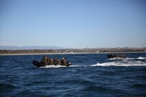 Marines with Company A, 1st Reconnaissance Battalion, 1st Marine Division, pilot Combat Rubber Raiding Craft during helocast training off the coast of Marine Corps Base Camp Pendleton, Calif., Nov. 6, 2015. Helocasting allows Marines to swiftly and stealthily insert from a helicopter into any body of water in order to then utilize Combat Rubber Raiding Craft to conduct amphibious beach reconnaissance and raids. (Official Marine Corps photo by Cpl. Will Perkins)