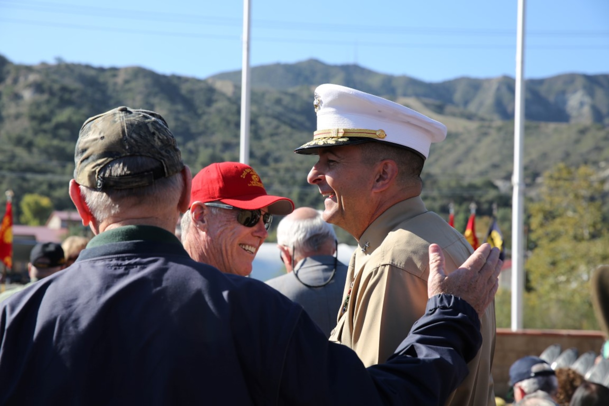 Maj. Gen. Daniel O’Donohue, right, commanding general of 1st Marine Division, shares stories with Vietnam veterans prior to a ceremony honoring members of 2nd Battalion, 1st Marine Regiment who gave their lives during the Vietnam War. During the ceremony, plaques bearing the names of the fallen were dedicated in their honor at the Camp Horno Memorial Garden aboard Camp Pendleton. (U.S. Marine Corps photo by Sgt. Paris Capers/ Released)