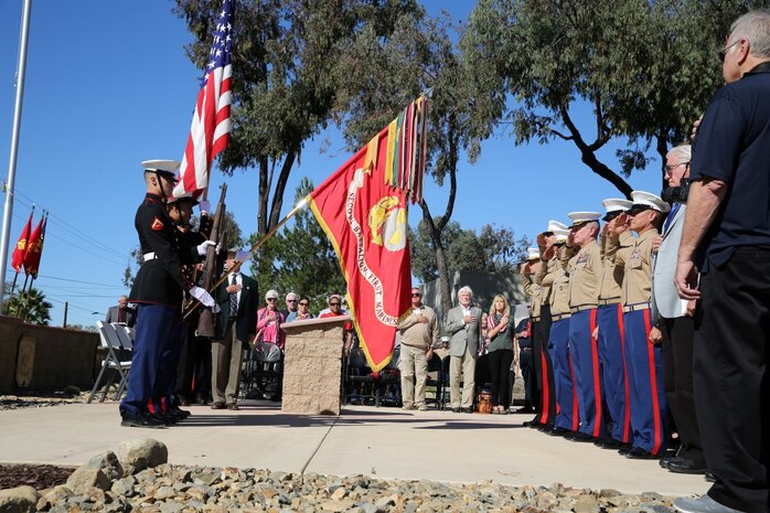 U.S. Marines with 2nd Battalion, 1st Marine Regiment, the ground combat element of the 13th Marine Expeditionary Unit, present the colors during a ceremony honoring members of their regiment who gave their lives during the Vietnam War. During the ceremony, plaques bearing the names of the fallen were dedicated in their honor at the Camp Horno Memorial Garden aboard Camp Pendleton. (U.S. Marine Corps photo by Sgt. Paris Capers/ Released)
