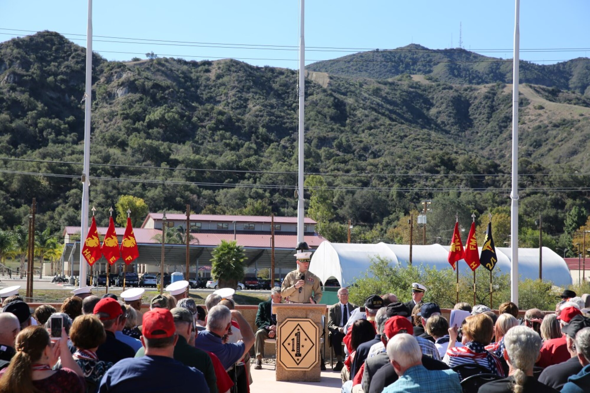 U.S. Marine Lt. Col. Jonathan Smith, battalion commander of 2nd Battalion, 1st Marine Regiment, the ground combat element of the 13th Marine Expeditionary Unit, speaks to Vietnam veterans, their friends and family during a ceremony honoring members of their regiment who gave their lives during the Vietnam War. During the ceremony, plaques bearing the names of the fallen were dedicated in their honor at the Camp Horno Memorial Garden aboard Camp Pendleton. (U.S. Marine Corps photo by Sgt. Paris Capers/ Released)