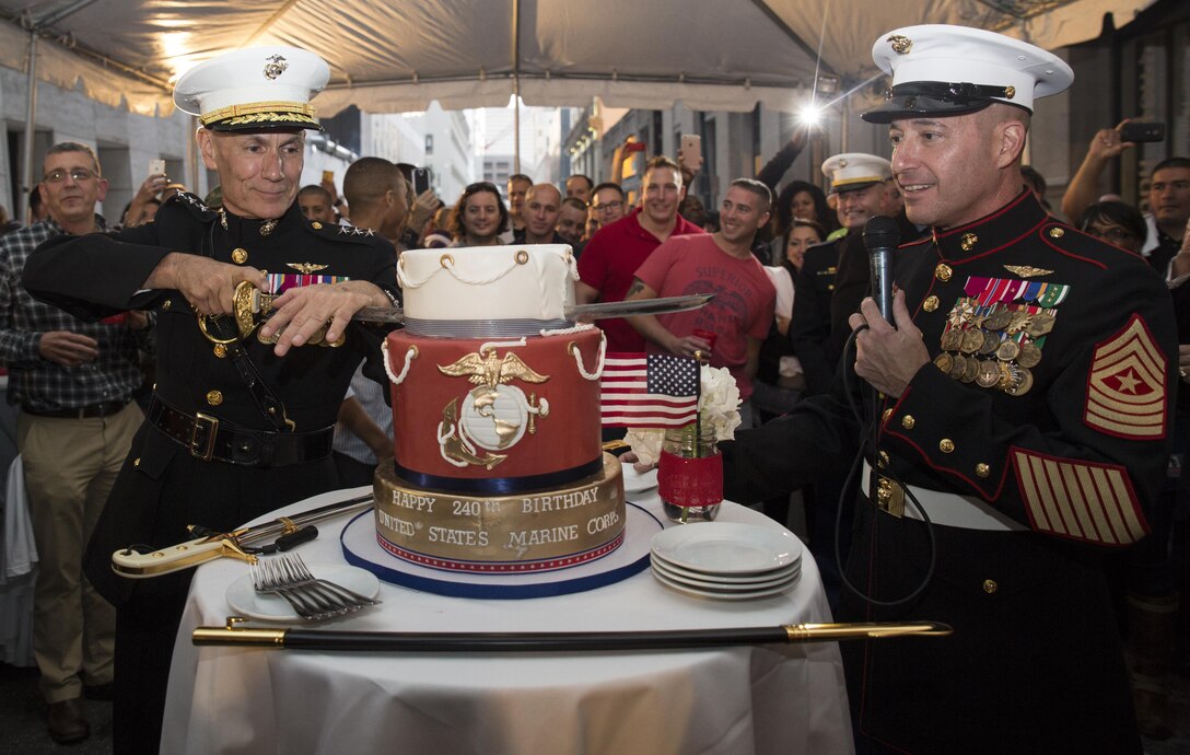Lt. Gen. Rex C. McMillian (left), commander of Marine Forces Reserve, cuts the first slice of cake while Sgt. Maj. Anthony A. Spadaro (right), sergeant major of Marine Forces Reserve, speaks about the significance of the cake-cutting ceremony during a Marine Corps Birthday celebration at Luke restaurant in New Orleans, Nov. 10, 2015. Marines and Marine veterans gathered at the restaurant to celebrate the 240th Marine Corps Birthday, commemorating the establishment of the Marine Corps on Nov. 10, 1775. (U.S. Marine Corps photo by Cpl. Ian Leones/Released)