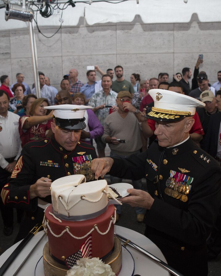 Lt. Gen. Rex C. McMillian (right), commander of Marine Forces Reserve, and Sgt. Maj. Anthony A. Spadaro (left), sergeant major of MARFORRES, prepare the first slice of cake during a cake-cutting ceremony at Luke restaurant in New Orleans, Nov. 10, 2015. Marines and Marine veterans gathered at the restaurant to celebrate the 240th Marine Corps Birthday, commemorating the establishment of the Marine Corps on Nov. 10, 1775. (U.S. Marine Corps photo by Cpl. Ian Leones/Released)
