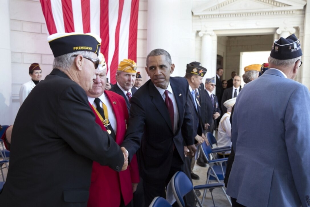 President Barack Obama greets veterans and guests at the conclusion of the Veterans Day ceremony at Arlington National Cemetery in Arlington, Va., Nov. 11, 2015. White House photo by Pete Souza