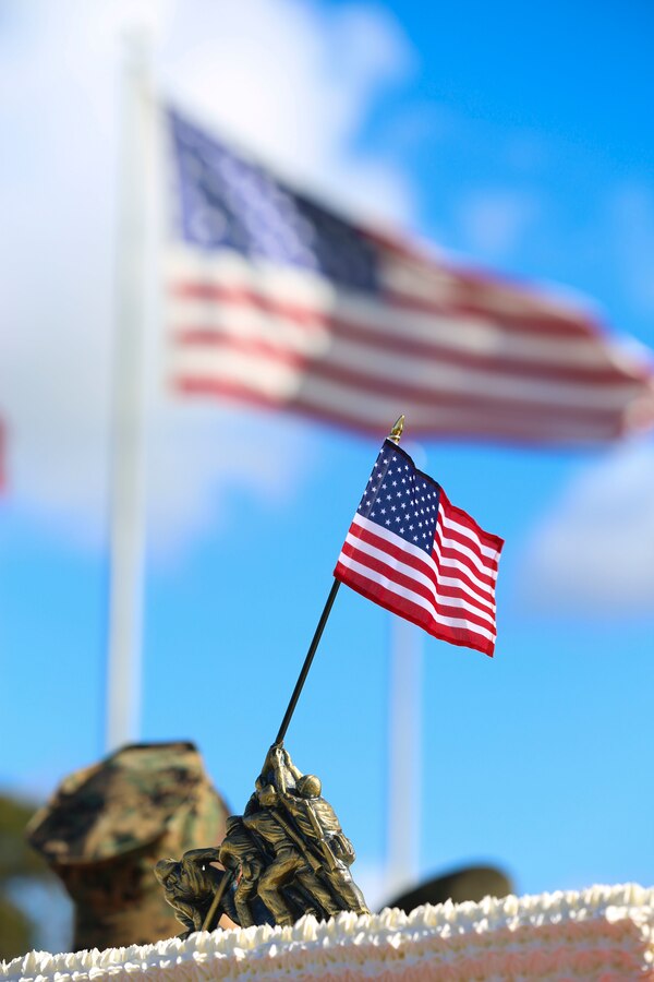 A miniature statue of Marines raising the national flag at Iwo Jima sits on top of the Marine’s birthday cake during the Marine Corps Air Station Miramar and 3rd Marine Aircraft Wing cake-cutting ceremony aboard MCAS Miramar, Calif., Nov. 10. The cake-cutting ceremony is a time-honored tradition used to celebrate the birth of the Marine Corps.
